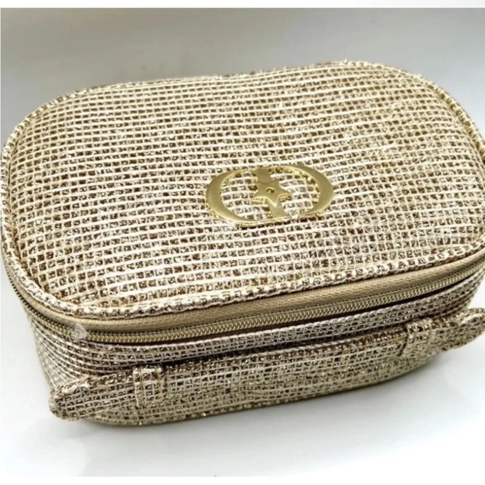 Dior 2025 Limited Holiday Edition cosmetic pouch in a gold, sparkly material.